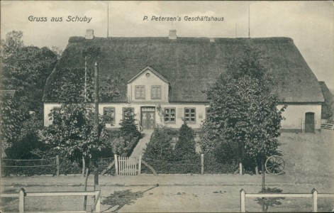 Alte Ansichtskarte Gruss aus Schuby, P. Petersen's Geschäftshaus