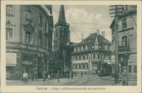 Alte Ansichtskarte Leverkusen-Opladen, Cölner- und Düsseldorferstraße mit kath. Kirche, Straßenbahn